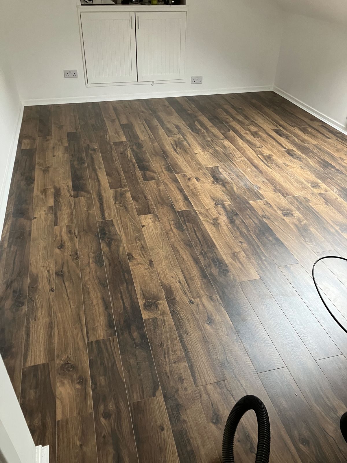 Dark Oak-Effect Laminate in a Loft Room — gallery photo