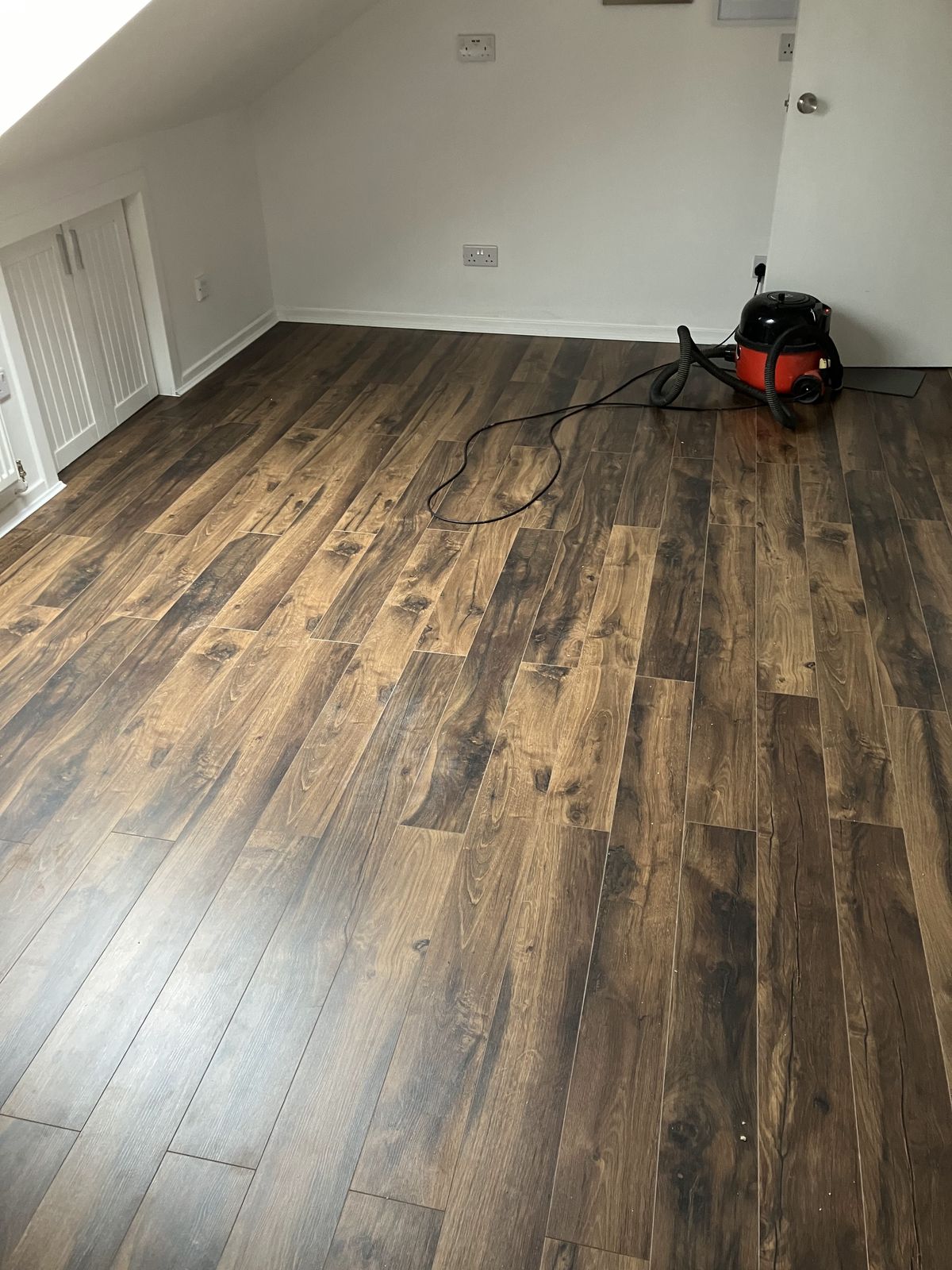 Dark Oak-Effect Laminate in a Loft Room — gallery photo