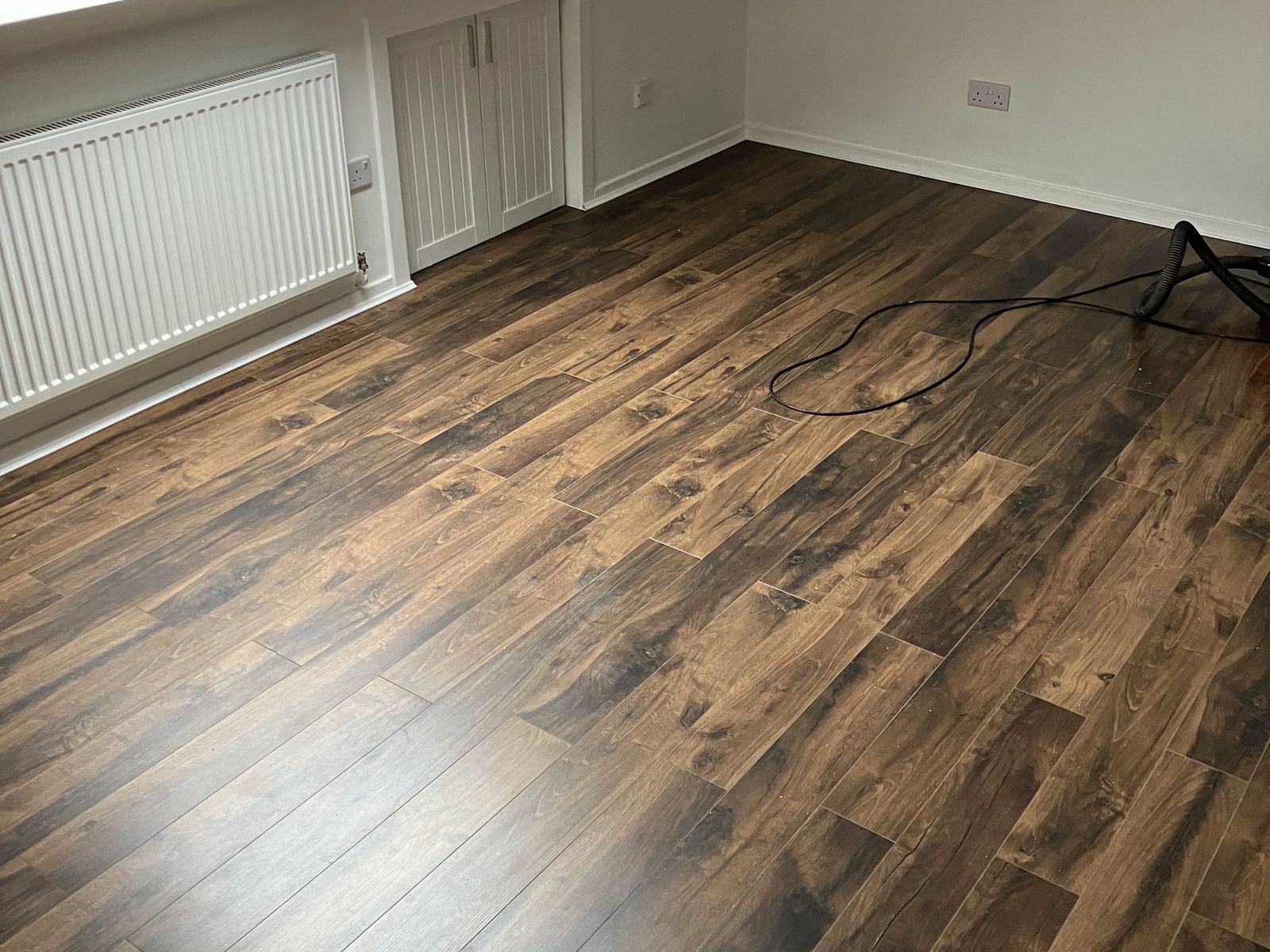 Dark Oak-Effect Laminate in a Loft Room — finished work in Lanarkshire