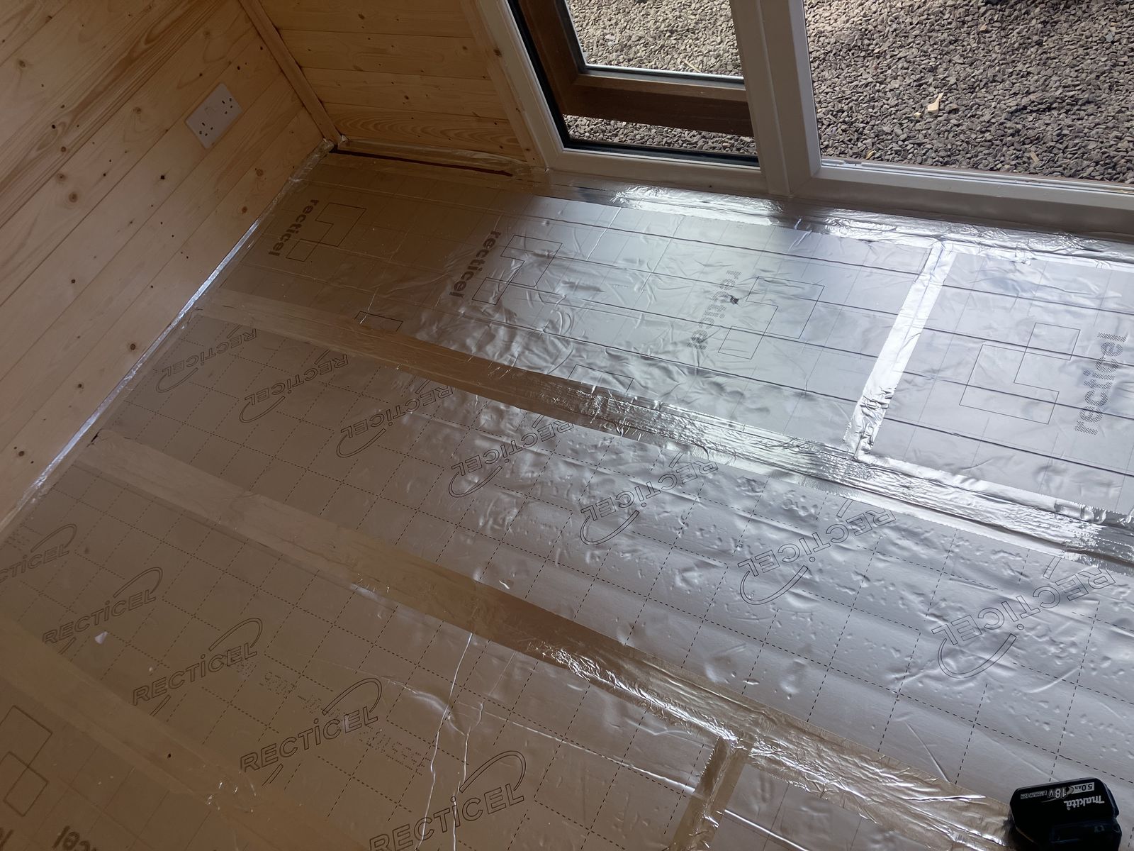 Floor Insulation and LVT Flooring in a Garden Cabin — gallery photo