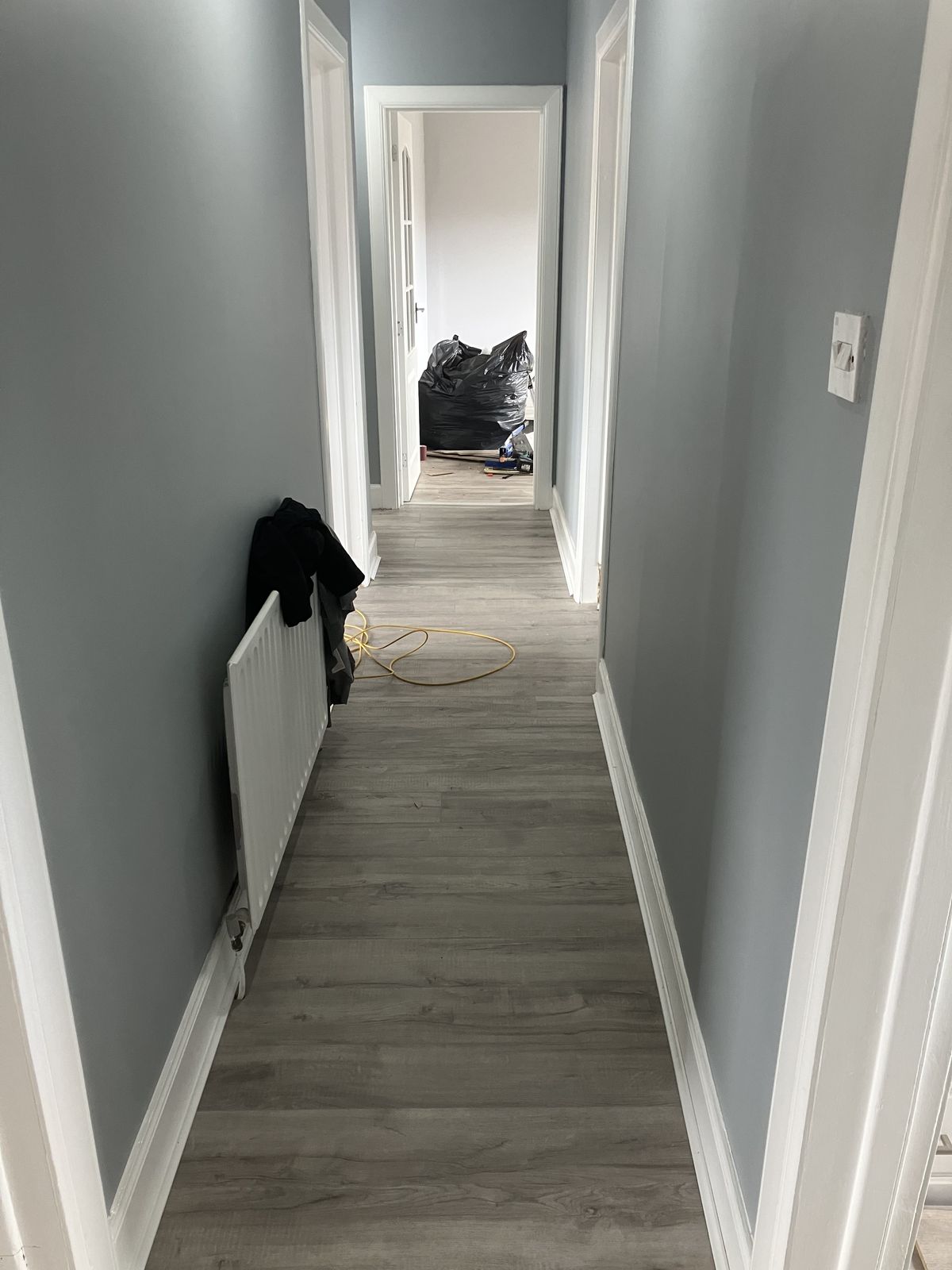 Grey Laminate Through the Hall and Rooms — gallery photo