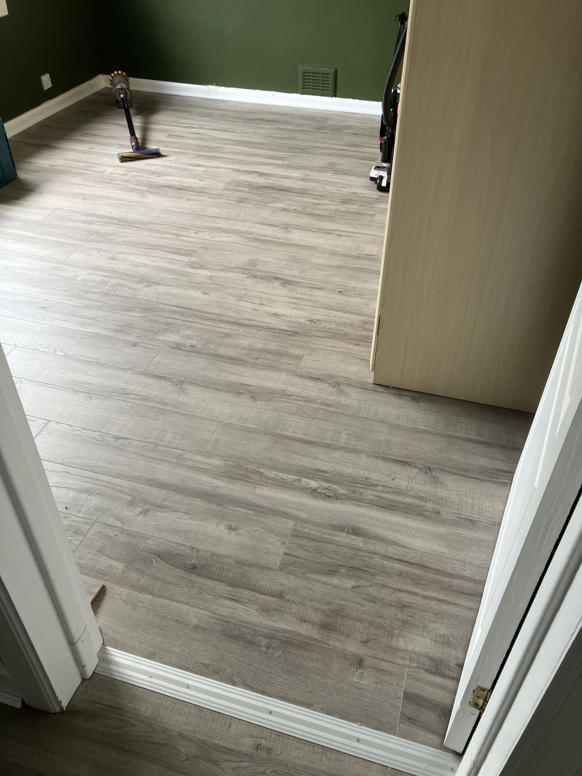 Grey Laminate Through the Hall and Rooms — gallery photo