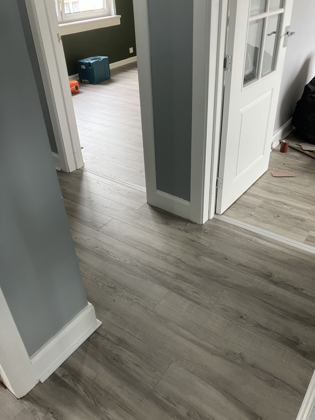 Grey Laminate Through the Hall and Rooms — gallery photo