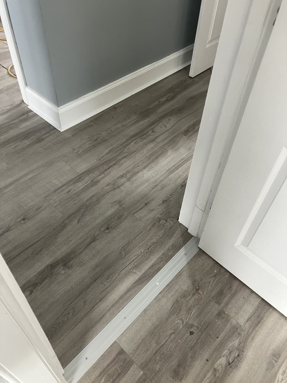 Grey Laminate Through the Hall and Rooms — gallery photo
