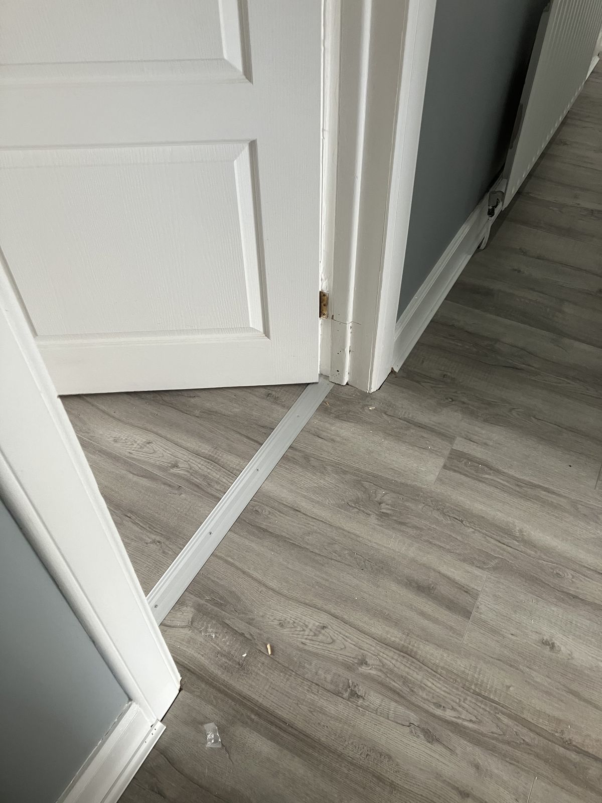 Grey Laminate Through the Hall and Rooms — gallery photo