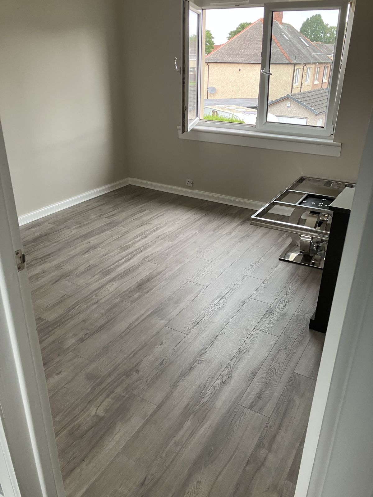 Grey Laminate Through the Hall and Rooms — gallery photo