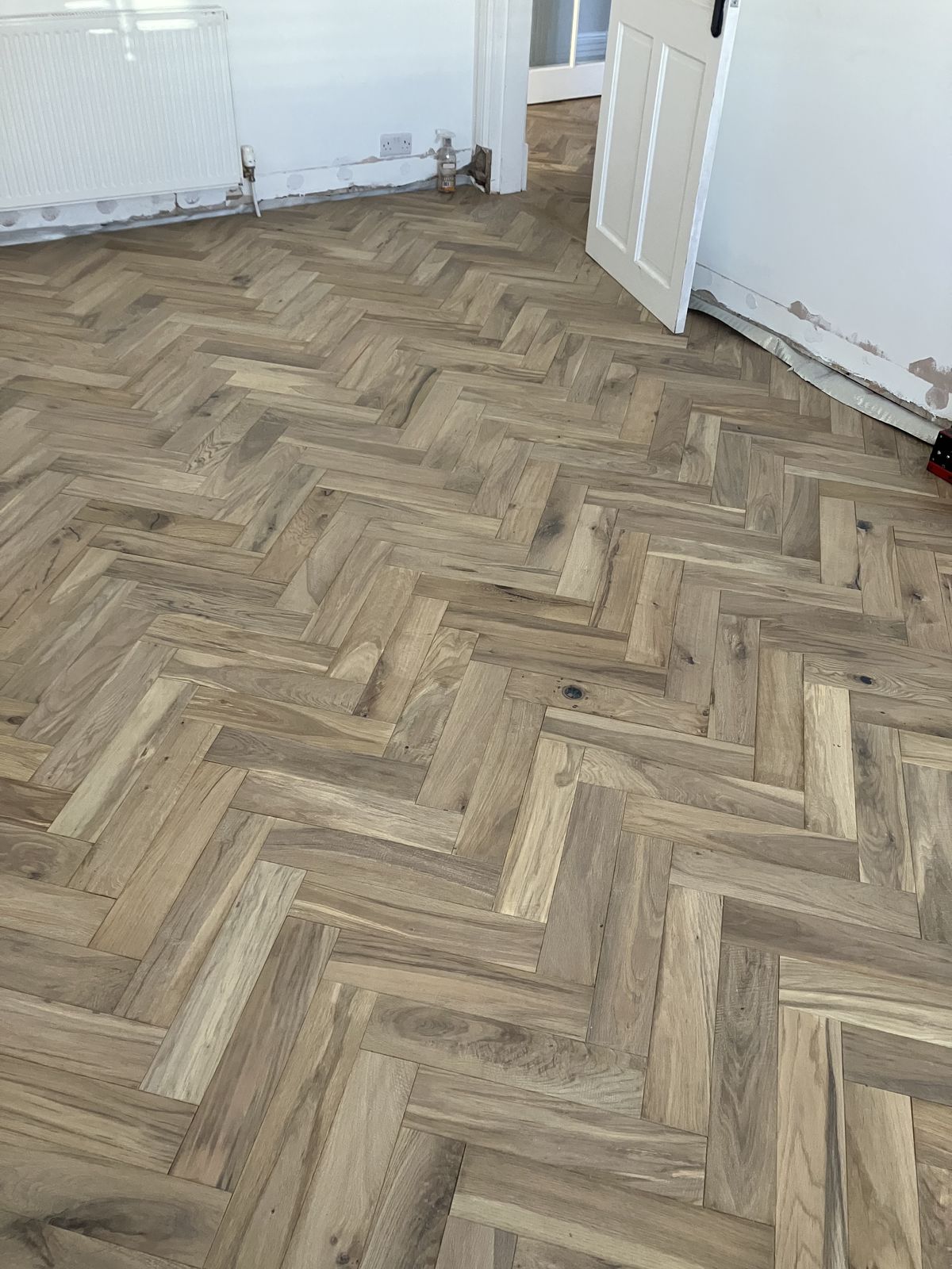 Herringbone Floor in a Bay-Window Room — gallery photo