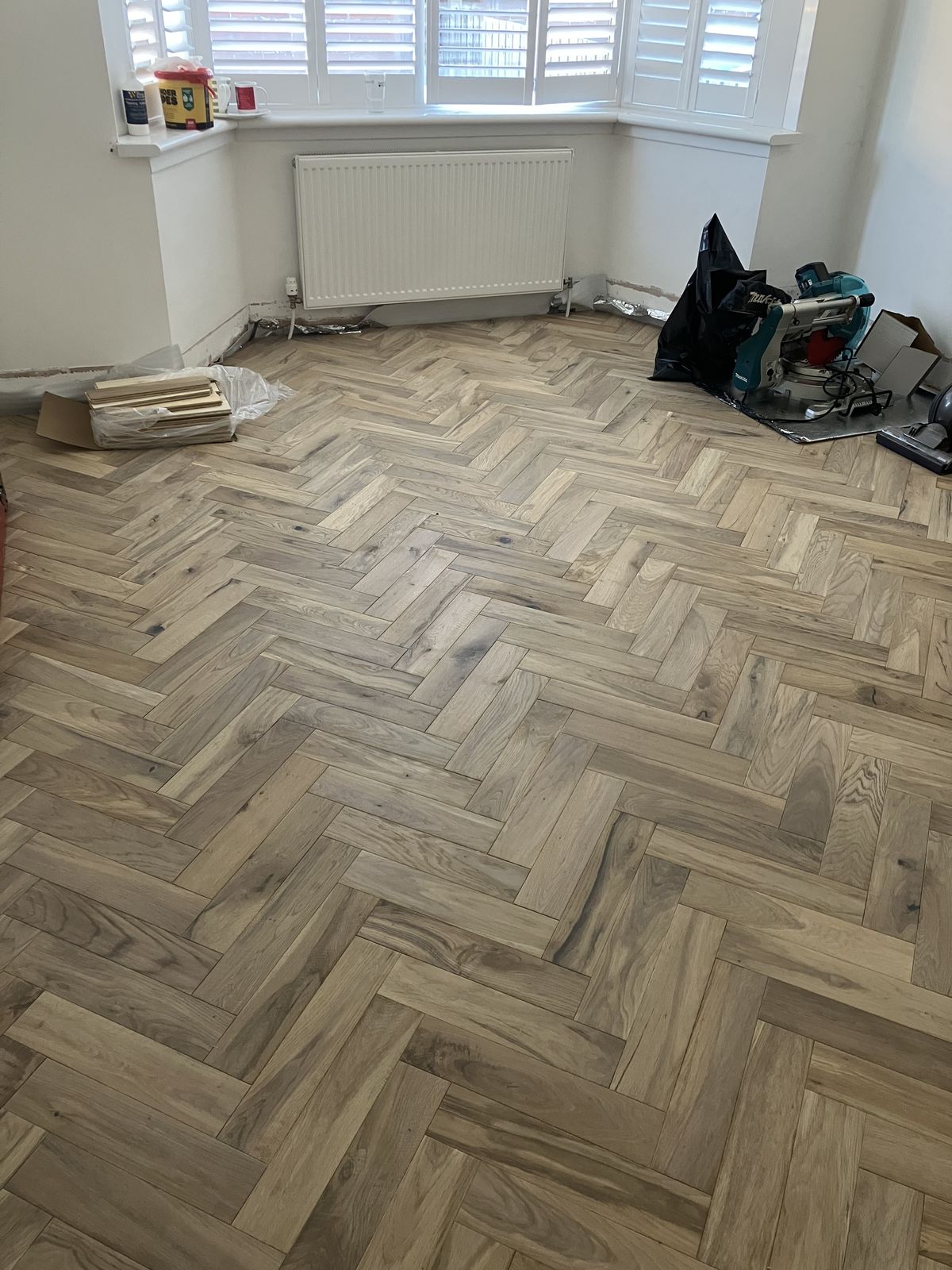 Herringbone Floor in a Bay-Window Room — gallery photo