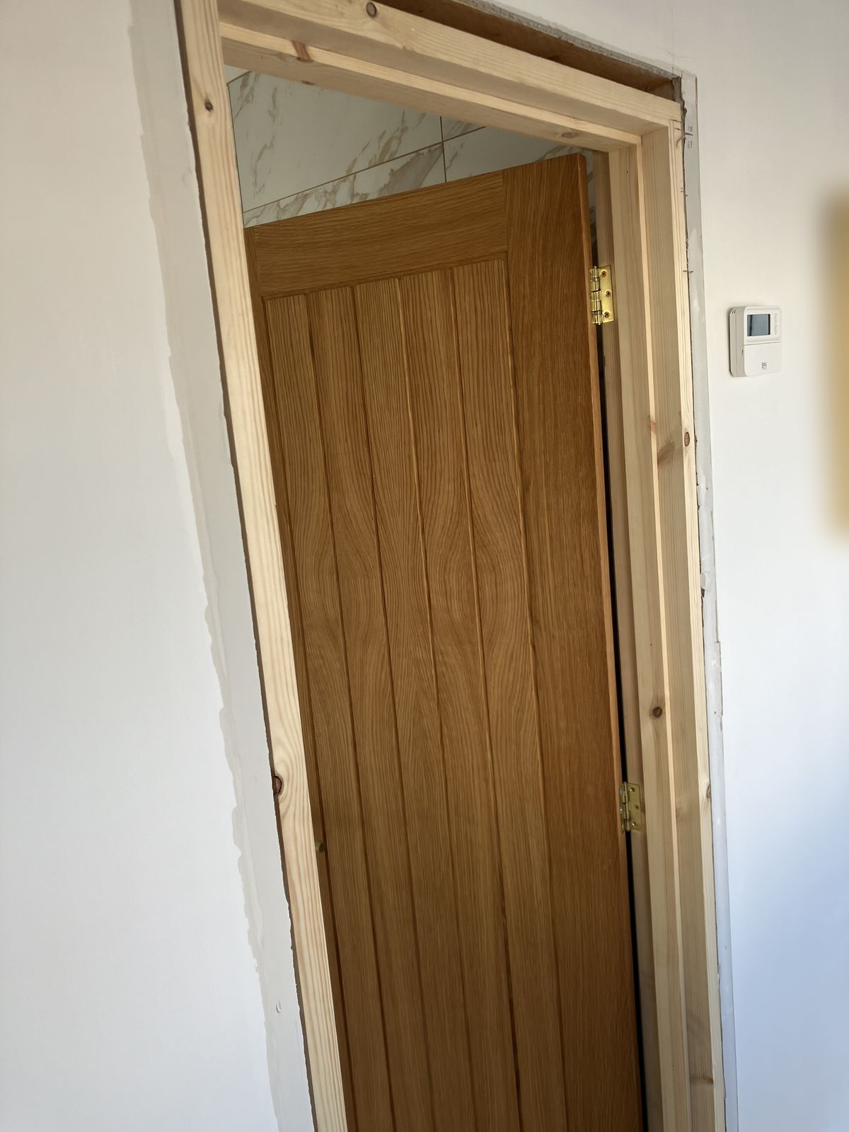 Oak Doors, Hall Panelling and a Render Repair — gallery photo