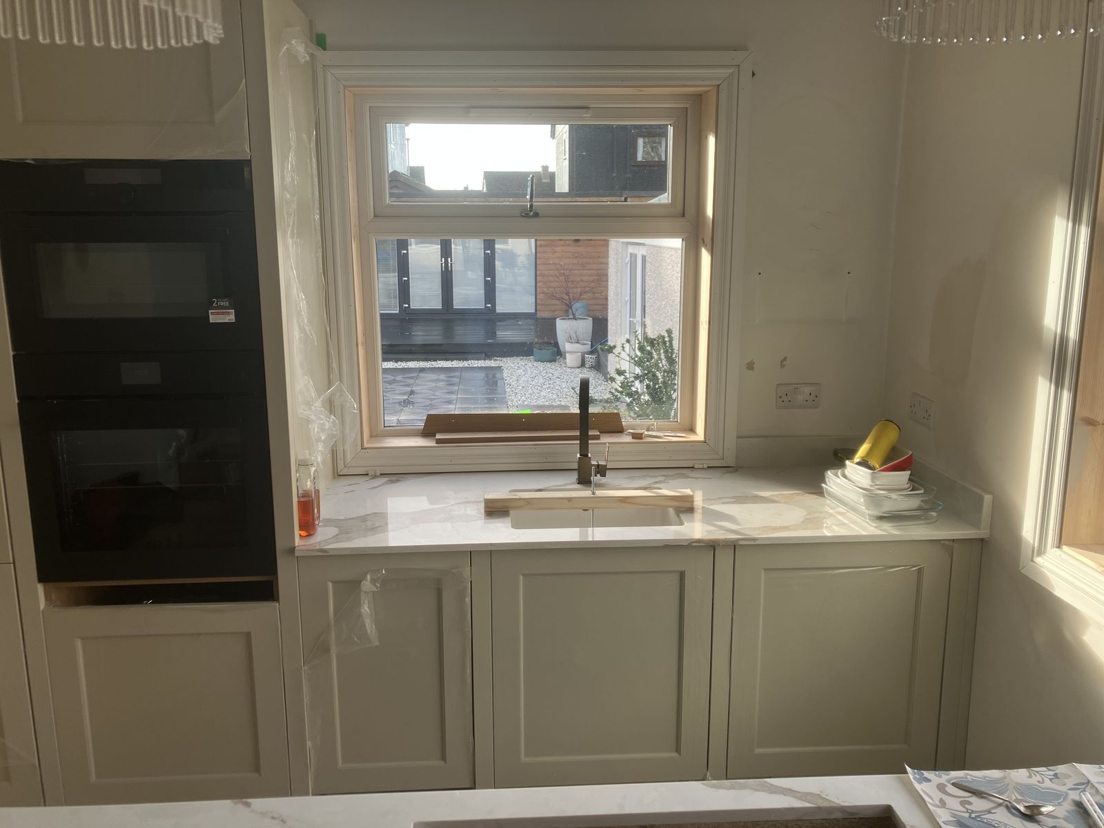Two-Tone Shaker Kitchen with a Waterfall Island — gallery photo