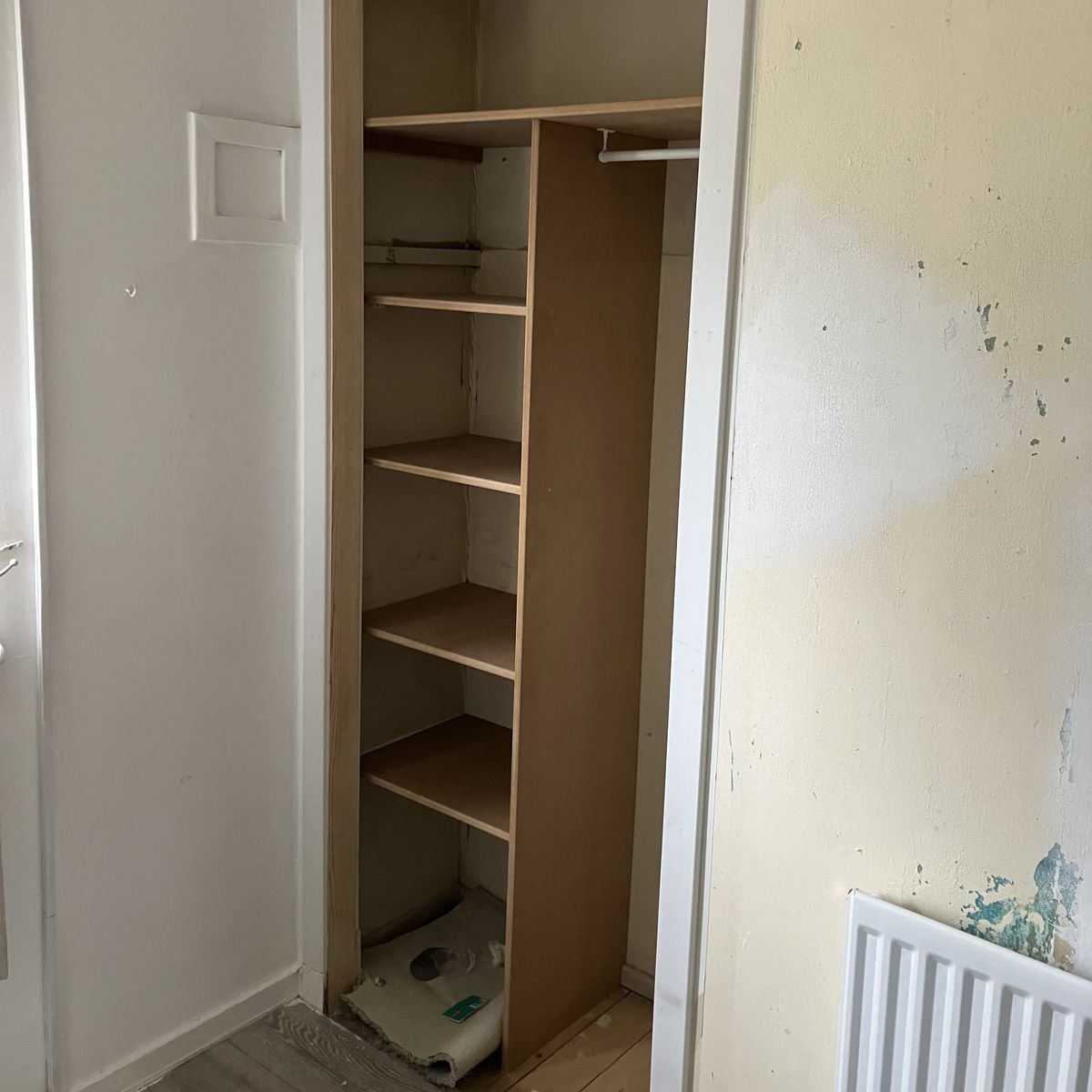 After: Shelves and a Hanging Rail in a Built-In Cupboard in Lanarkshire