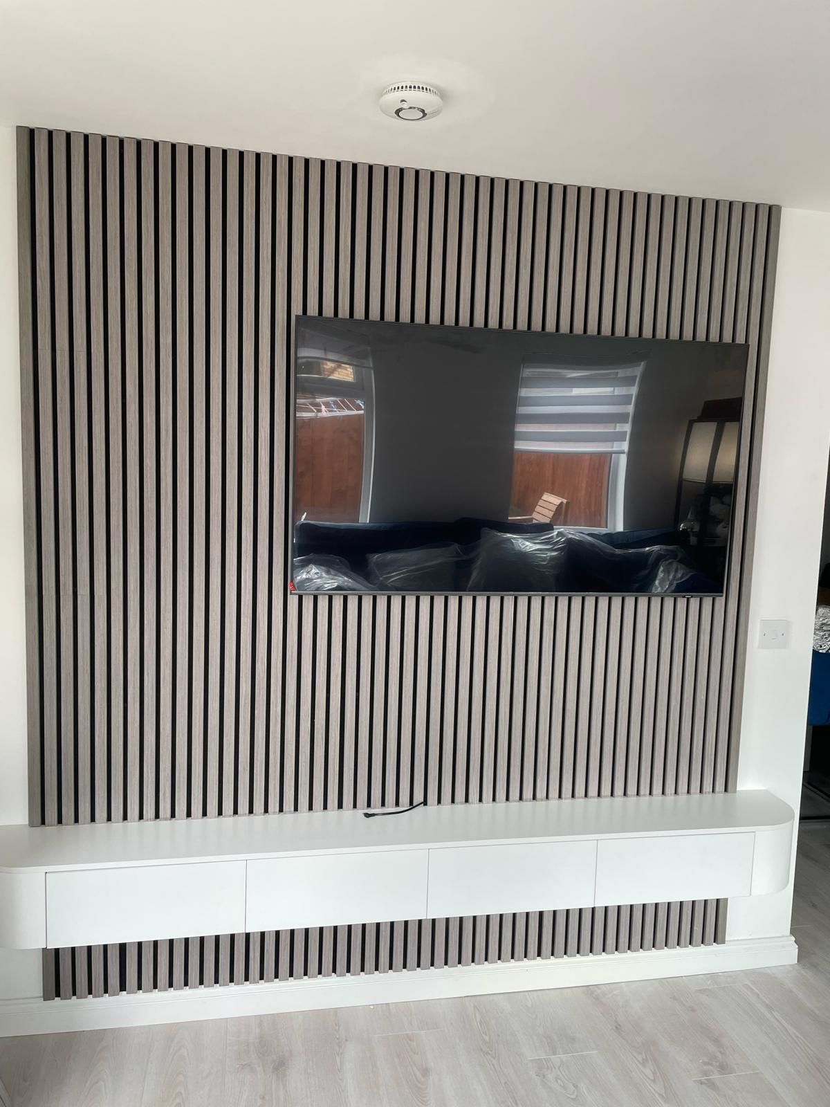 Slat Media Wall with a Floating TV Unit — gallery photo