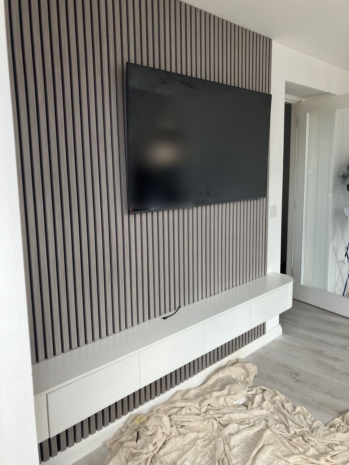 Slat Media Wall with a Floating TV Unit — gallery photo