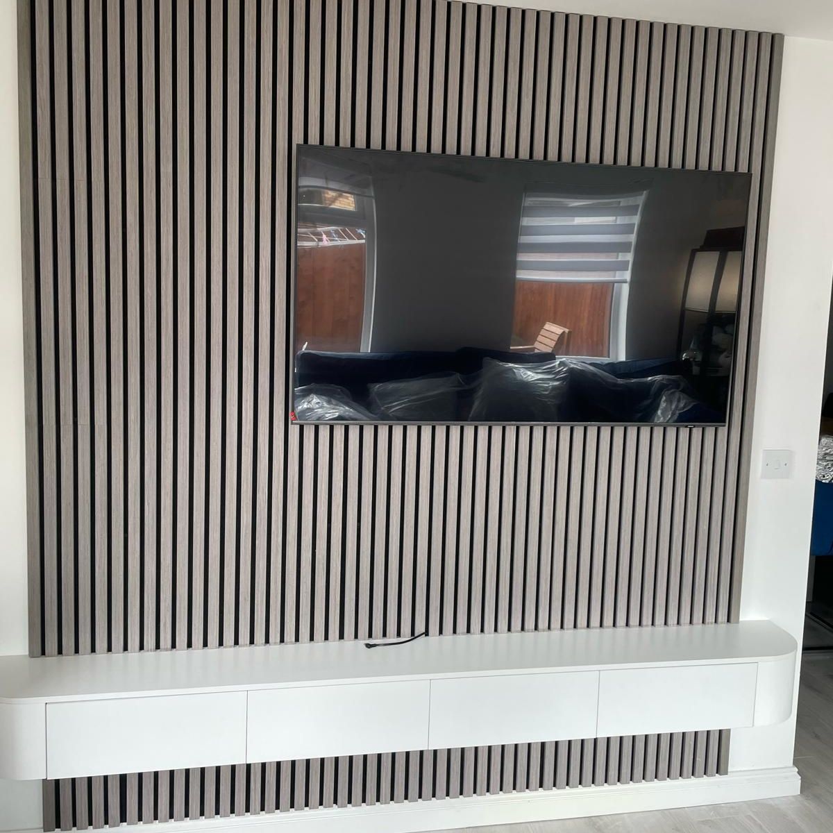 After: Slat Media Wall with a Floating TV Unit in Lanarkshire